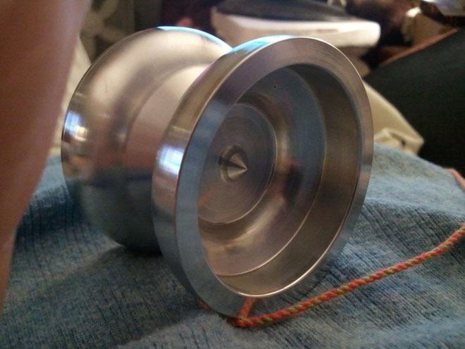 An aluminum yoyo. The deep face cavity required a special face-grooving tool. 