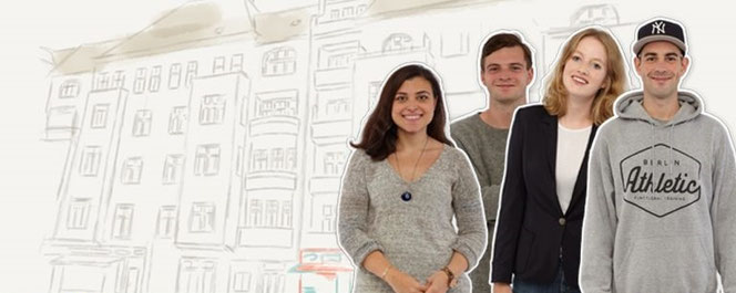 Föhliche Menschen die vor einem großen Gebäude stehen