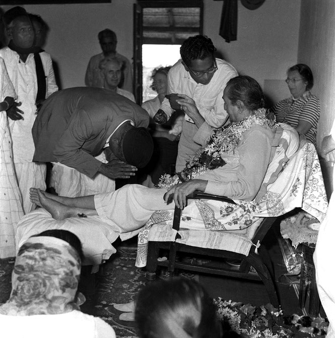 30th June 1957 - Lower Meherabad, India. (L-R) Sadashiv Patil, Laxman Kamble (bowing), Adi K. Irani, Francis & Ola Goldney, Digambar Gadekar next to Baba & Irene Conybeare. Digambar's mother - Gunatai (scarf) is seated facing Baba . Photo taken by Meela