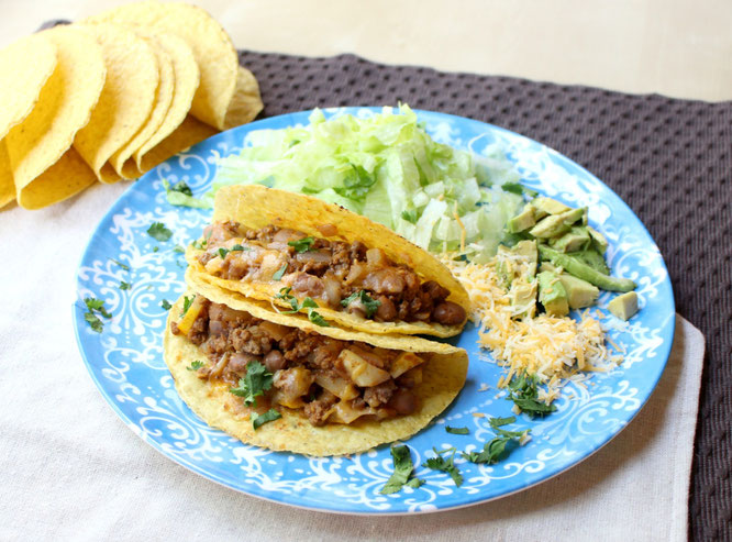 Easy, cheesy beef tacos are so simple to make with just a few healthy ingredients and about 20 minutes total.  Easy high protein, gluten free weeknight dinner! www.homemadenutrition.com