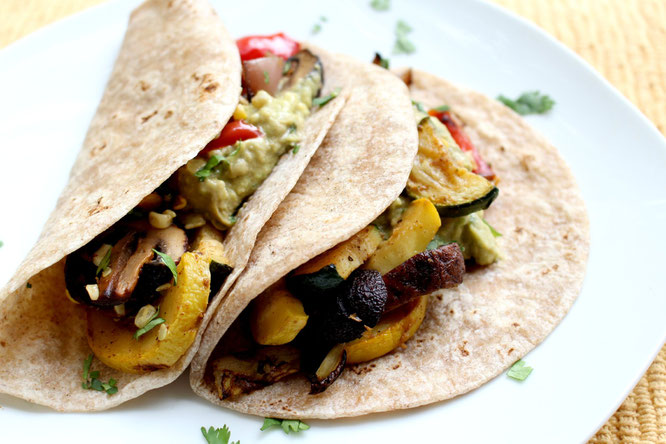 Vegan grilled veggie tacos are perfect for a light spring or summer dinner!  These can also be made in the oven and keep very well as leftovers - www.homemadenutrition.com