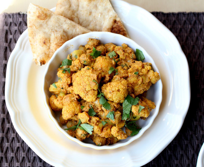 Vegan Cauliflower and Chickpea Curry with cocunt milk, ginger, garlic, and amazing Indian spices!  This one-skillet dinner is ready in under 30  minutes! - by homemade nutrition - www.homemadenutrition.com