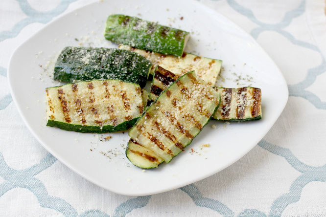 Grilled parmesan zucchini is one of the best ways to enjoy this delicious family-friendly veggie.  This recipe has only 5 main ingredients and comes together in minutes!  You can also use this several different ways.  www.homemadenutrition.com