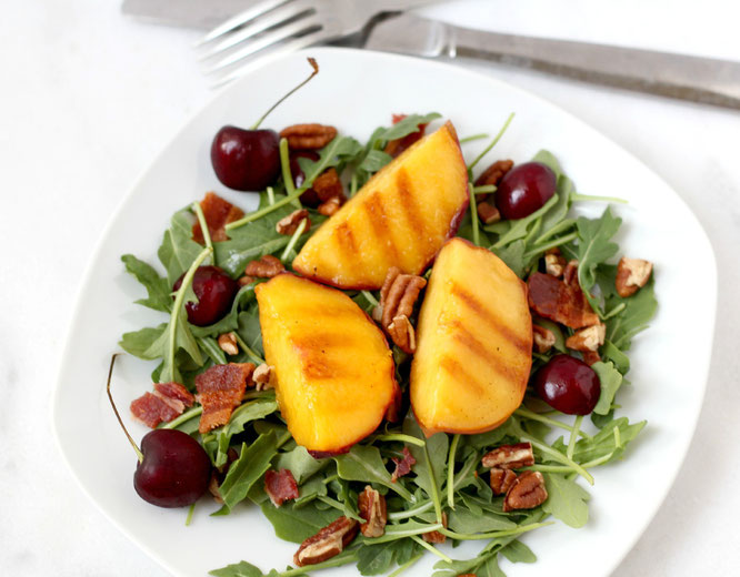 Nothing says summer like this salad! Grilled peaches, fresh cherries, pecans, and bacon make for the ultimate combination of sweet and salty flavors. - www.homemadenutrition.com
