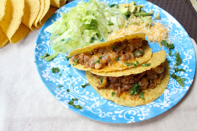 Easy, cheesy beef tacos are so simple to make with just a few healthy ingredients and about 20 minutes total.  Easy high protein, gluten free weeknight dinner! www.homemadenutrition.com
