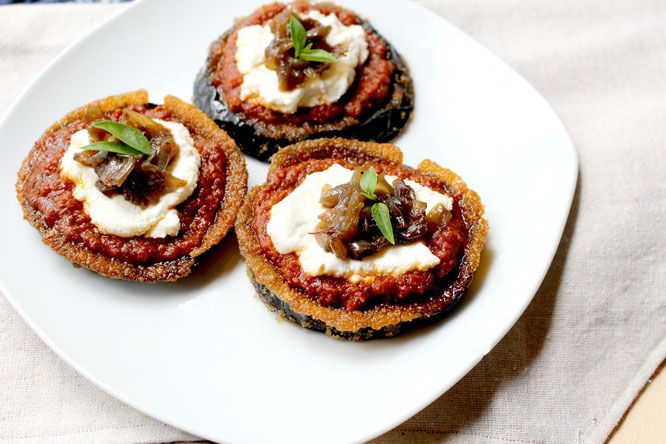 Baked eggplant makes the base of these flavorful pizzas topped with sun dried tomato pesto, ricotta, and caramilized onions.   These are delicious and simple! - www.homemadenutrition.com