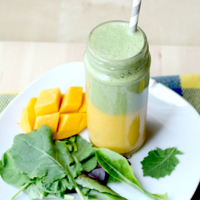 This layered smoothie has a sweet mango-banana base with an apple, greens, and tea smoothie on top.  It's a whole new world of flavor with two smoothies in one! - www.homemadenutrition.com