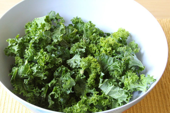 Fresh kale already cut into pieces and ready for oil, seasonings, and baking for kale chips!