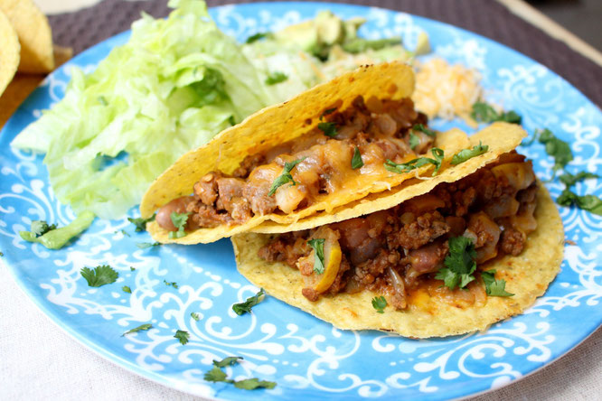 Easy, cheesy beef tacos are so simple to make with just a few healthy ingredients and about 20 minutes total.  Easy high protein, gluten free weeknight dinner! www.homemadenutrition.com