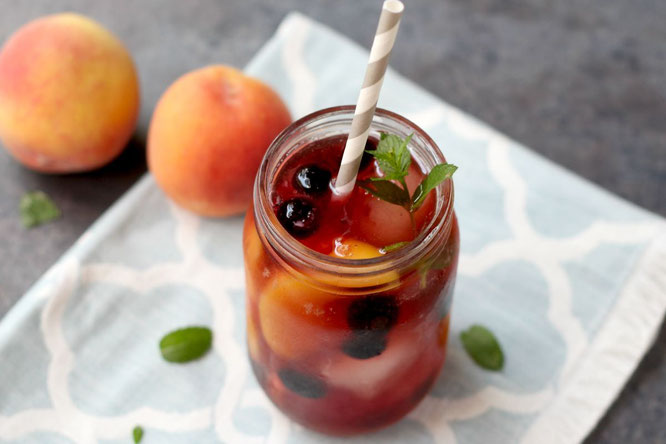 This sweet peach iced tea with blueberries has so much flavor and is a real show-stopper with all of the beautiful colors.  It's perfect for a sweet summer treat or a special drink when company comes over!