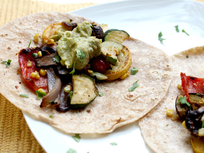 Vegan grilled veggie tacos are perfect for a light spring or summer dinner!  These can also be made in the oven and keep very well as leftovers - www.homemadenutrition.com