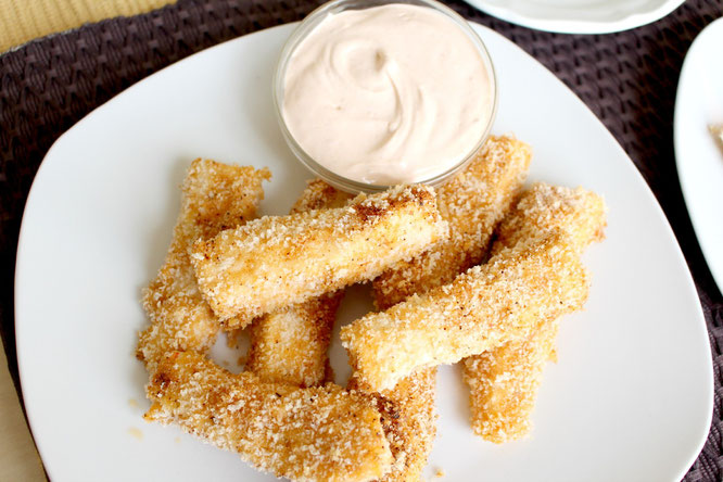 These homemade baked Southwestern fish sticks are easy to make with just five main ingredients and taste so much better than any frozen store bought version!   Plus an easy Southwestern ranch dipping sauce on the side! 