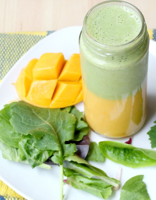 This layered smoothie has a sweet mango-banana base with an apple, greens, and tea smoothie on top.  It's a whole new world of flavor with two smoothies in one! - www.homemadenutrition.com