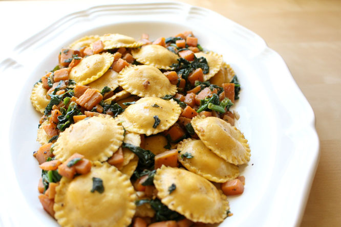 Beautiful vegetarian dish with ravioli and garlicky sauteed sweet potatoes and spinach.  Perfect flavor combinations! - by homemade nutrition - www.homemadenutrition.com