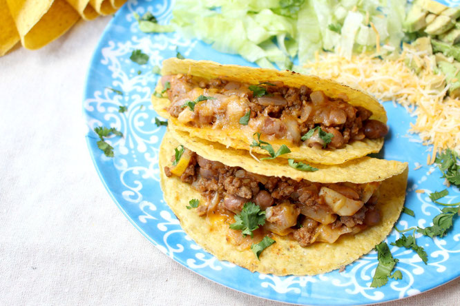 Easy, cheesy beef tacos are so simple to make with just a few healthy ingredients and about 20 minutes total.  Easy high protein, gluten free weeknight dinner! www.homemadenutrition.com