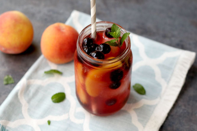 This sweet peach iced tea with blueberries has so much flavor and is a real show-stopper with all of the beautiful colors.  It's perfect for a sweet summer treat or a special drink when company comes over!