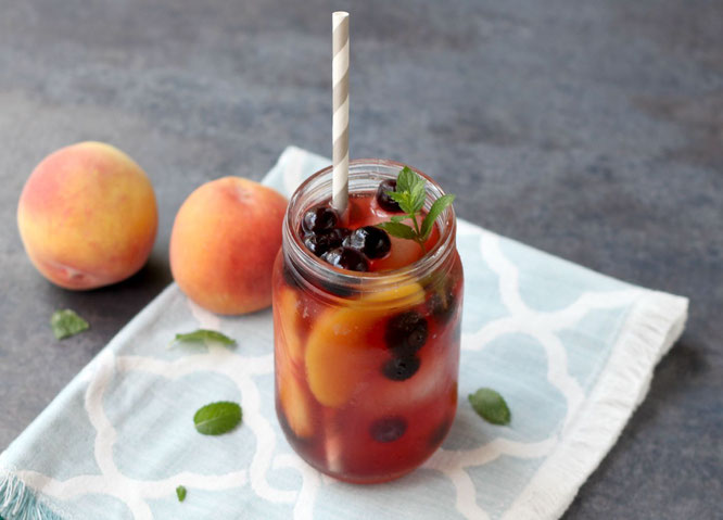 This sweet peach iced tea with blueberries has so much flavor and is a real show-stopper with all of the beautiful colors.  It's perfect for a sweet summer treat or a special drink when company comes over!