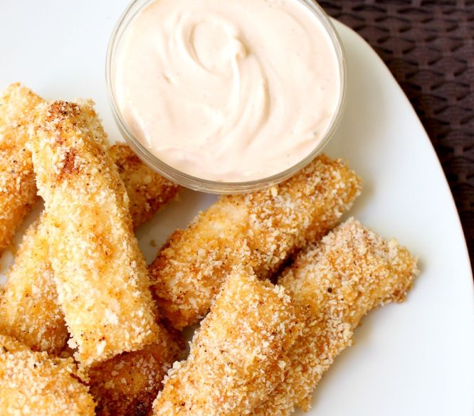 These homemade baked Southwestern fish sticks are easy to make with just five main ingredients and taste so much better than any frozen store bought version! Plus an easy Southwestern ranch dipping sauce on the side!