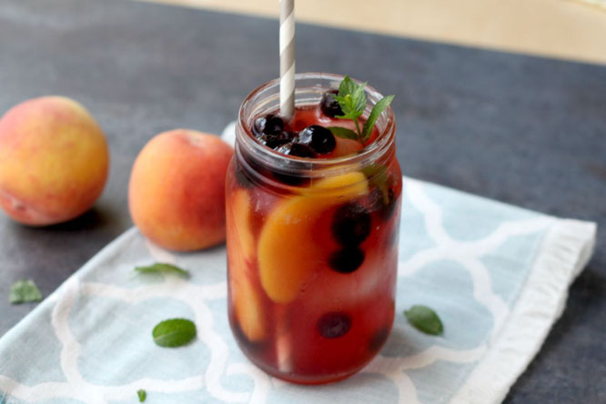 This sweet peach iced tea with blueberries has so much flavor and is a real show-stopper with all of the beautiful colors.  It's perfect for a sweet summer treat or a special drink when company comes over!