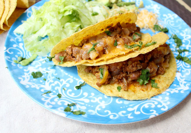 Easy, cheesy beef tacos are so simple to make with just a few healthy ingredients and about 20 minutes total.  Easy high protein, gluten free weeknight dinner! www.homemadenutrition.com