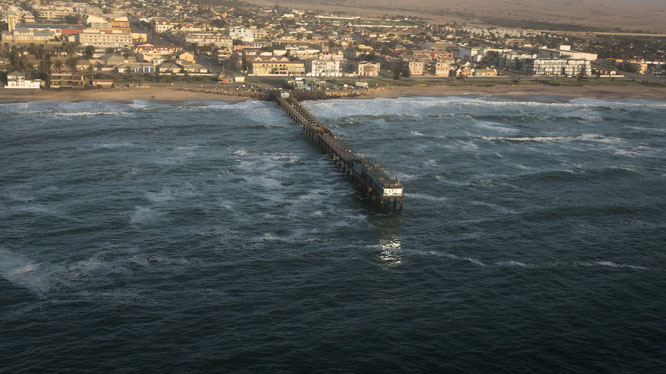 Bird`s eye view scenic flight famous landmark the jetty (built in 1905) of Swakobmund - Namib Desert Namibia