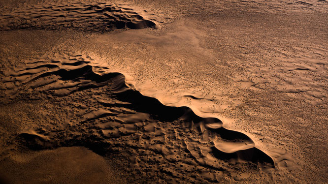 Red sand dunes in the areas of Sossusvlei - bird`s eye view, scenic flight - Namib Desert Namibia