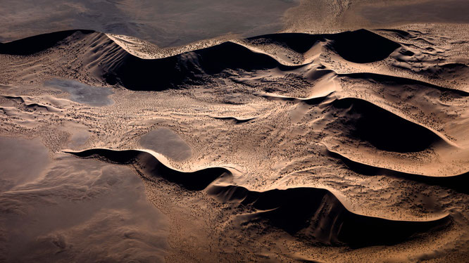 Red sand dunes in the areas of Sossusvlei - bird`s eye view, scenic flight - Namib Desert Namibia