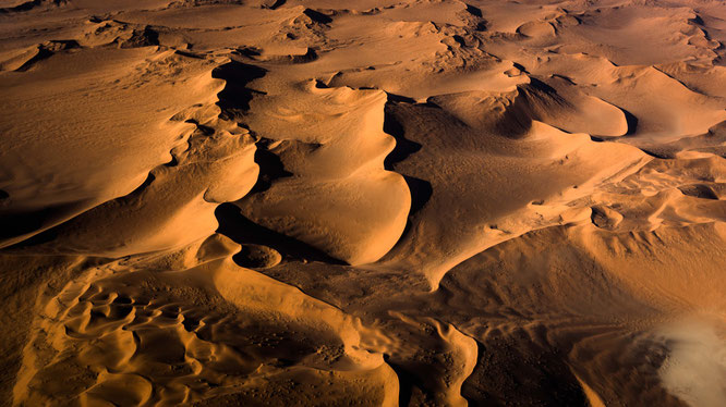 Red sand dunes in the areas of Sossusvlei - bird`s eye view, scenic flight - Namib Desert Namibia