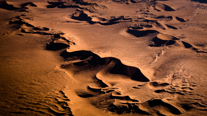 Red sand dunes in the areas of Sossusvlei - bird`s eye view, scenic flight - Namib Desert Namibia