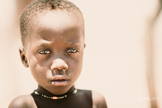 himba child red drum kaokoveld, faces of namibia 