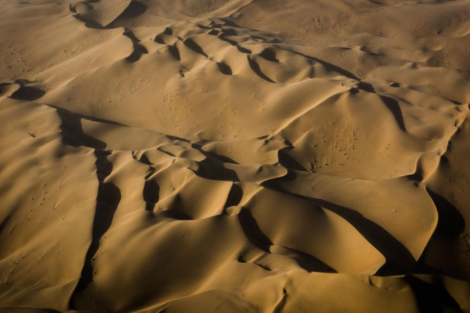 Red sand dunes in the areas of Sossusvlei - bird`s eye view, scenic flight - Namib Desert Namibia