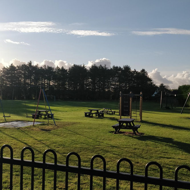 Foveran playground showing picnic benches, swings and climbing frame