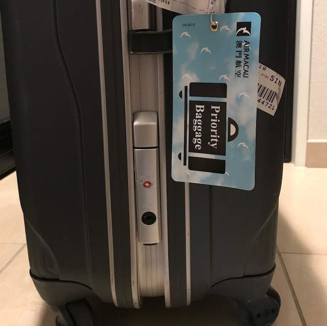 Suitcase with Priority Tag