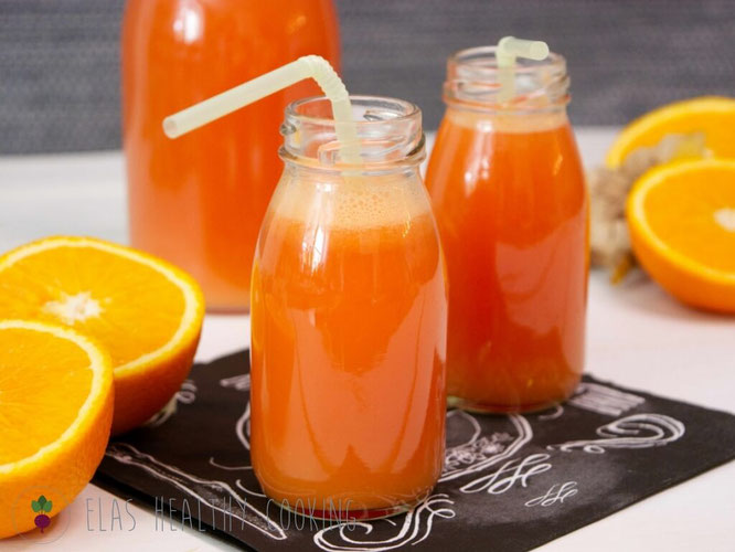 Ingwer-Melonen-Shot, dekoriert mit Orangen und Ingwer