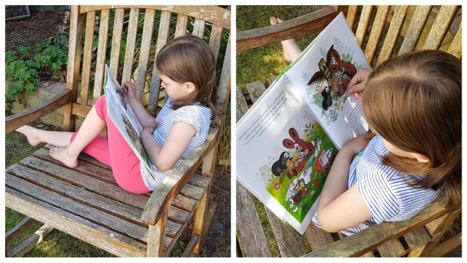 Unsere Kleine liest in den Büchern vom Maulwurf