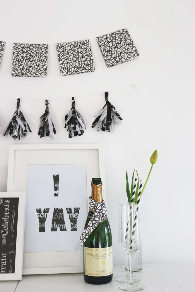 Bild: Schnelle Girlande zum selber basteln? Probier's mit dieser DIY Tassel Girlande aus Servietten als Partydeko, gefunden auf www.partystories.de
