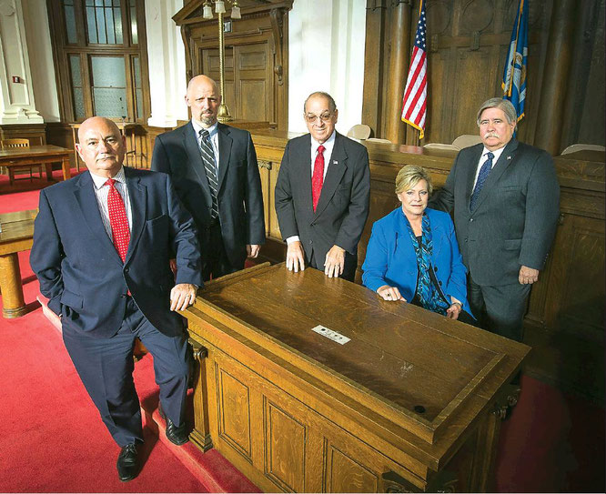 Calasieu Parish District Attorney John DeRosier is pictured with some of the experienced prosecutors who have mentored young felony prosecutors in his office, including special prosecutor Hugo Holland, special prosecutor Lea Hall, First Assistant District