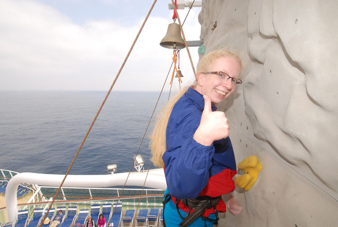 on top of the rock climbing wall onboard. The view was perfect!