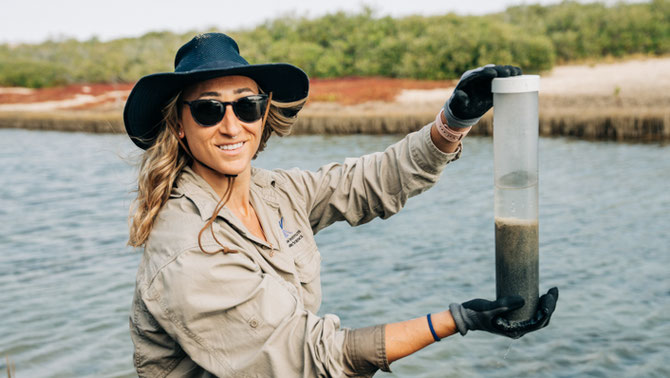 BLUE CARBON SEASCAPES SCIENTIST DR KAY DAVIS WITH A SOIL CORE COLLECTED AT MANGROVE BAY, NEAR EXMOUTH. PHOTO: VIOLETA JAHNEL BROSIG