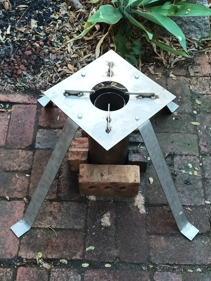 A complete outdoor cooking and sanitation system exposed to the elements, with an outer heat and wind shield tube, an inner 'Navigator Burner' and UPS (which can be unbolted and packed down), used with a soil 'quench' after a burn