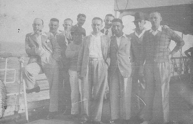 David Symon (7th from left) outward journey on M.V. Accra, 1935. The others are unnamed. David is the only man wearing a tie.  Photographer unknown.  