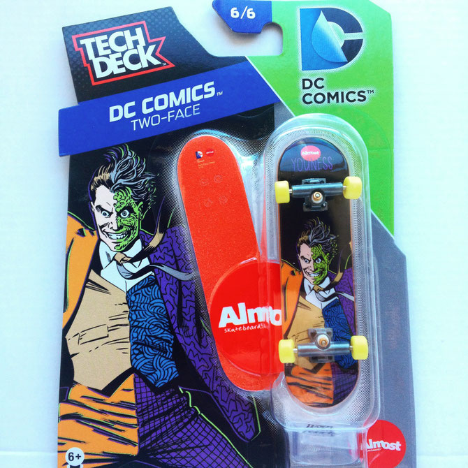Two-Face Tech Deck miniature skateboard.
