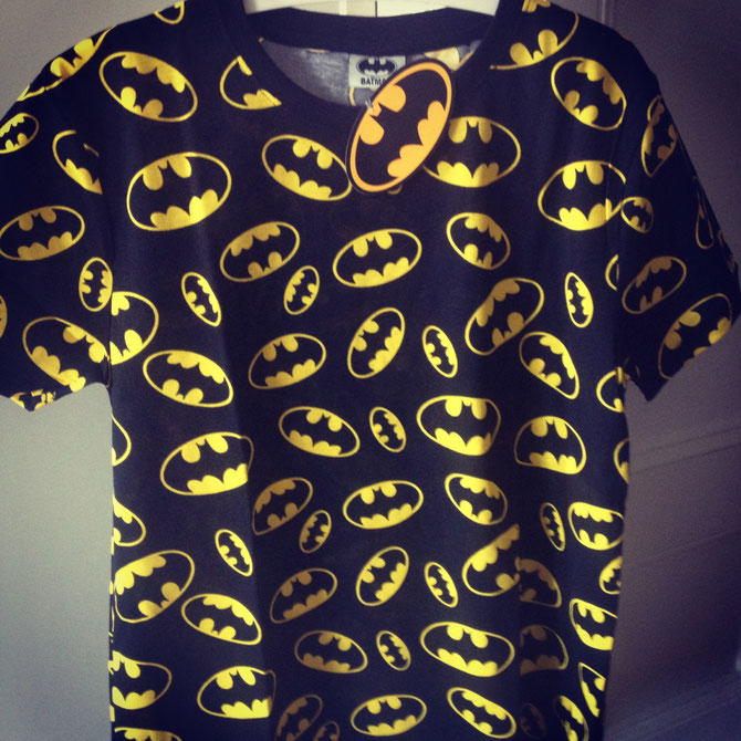 Batman logo T-shirt.