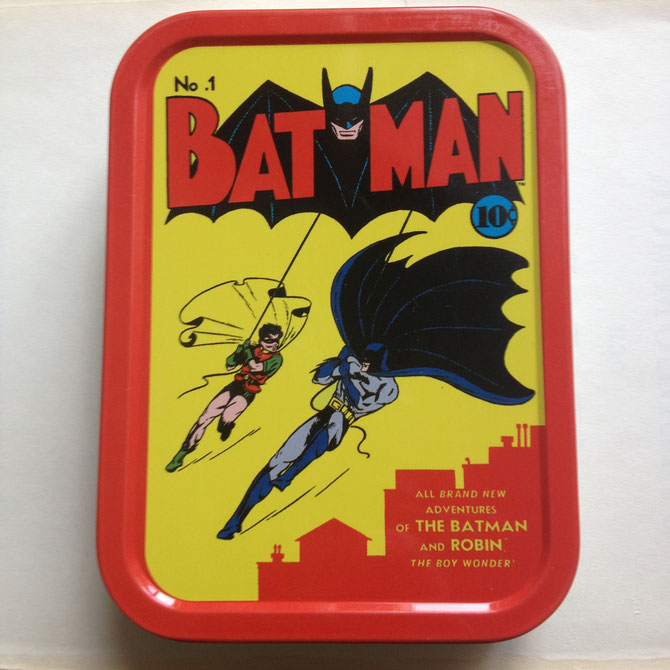 Batman #1 metal tin with a miniature puzzle inside.