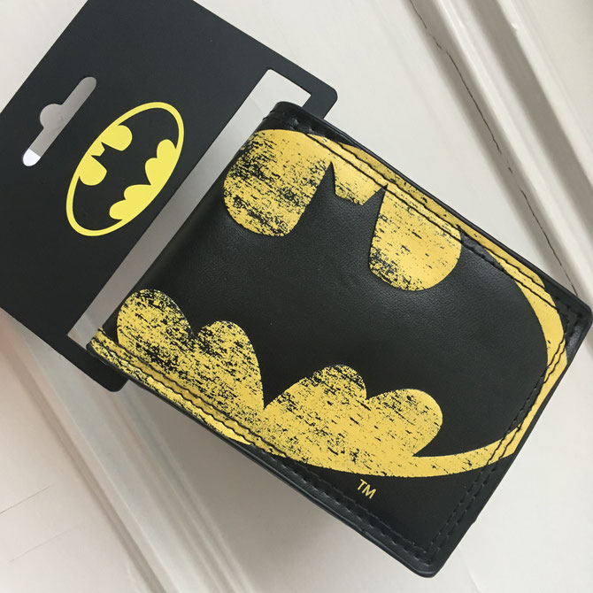 Batman wallet by Bioworld. Faux leather. Not happy with the quality or interior design.. but I bought it for the collection, not to use it.