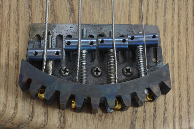 Bass guitar bridge built from a cog in (builds & work in progress) page