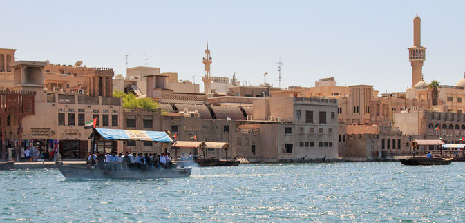 Dubai, United Arab Emirates - October 8, 2014: An Abra or water-taxi carries passengers across the creek, in modern day Dubai.
