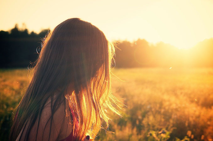girl looking at sunset