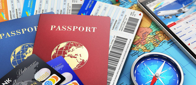 Travel photo of passports, maps, and credit cards
