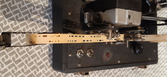 Teleplex new model of Master Teacher. Particular of perforated tape with international morse code